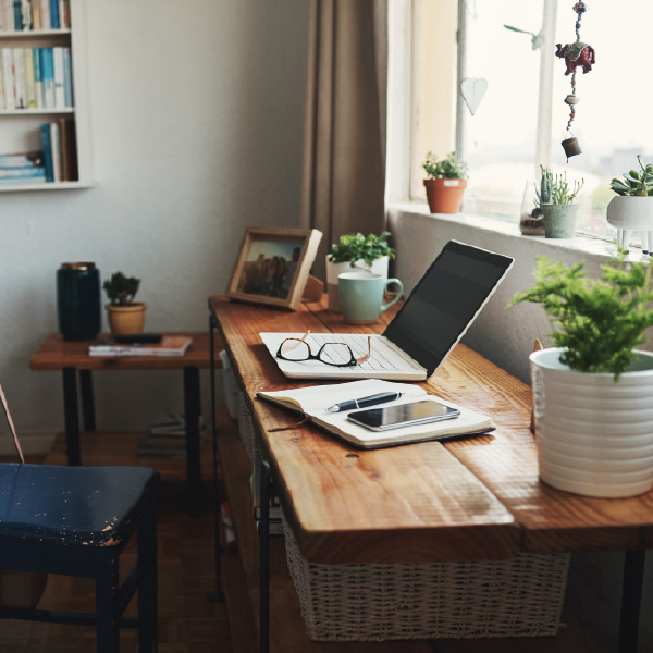 computer and phone sitting on a desk