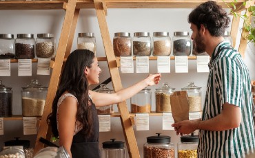 Customer and employee looking at products.