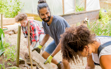 three people gardening